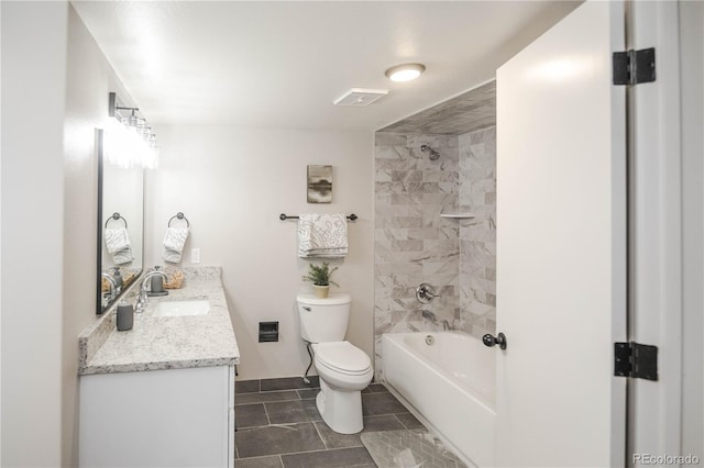 full bathroom with tile patterned flooring, vanity, toilet, and tiled shower / bath combo