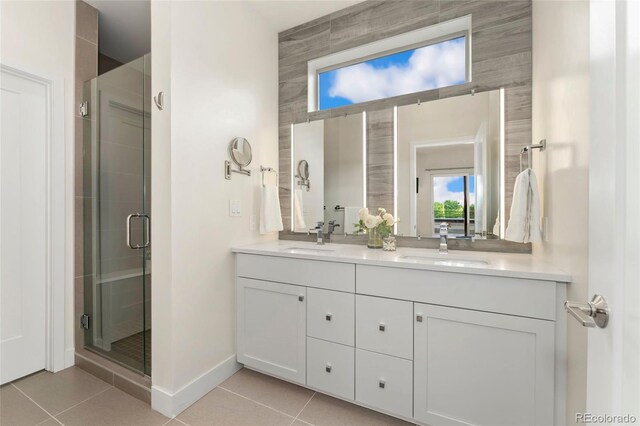 bathroom with tile patterned floors, an enclosed shower, and vanity