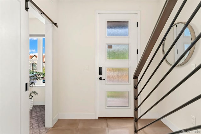 foyer with plenty of natural light and a barn door