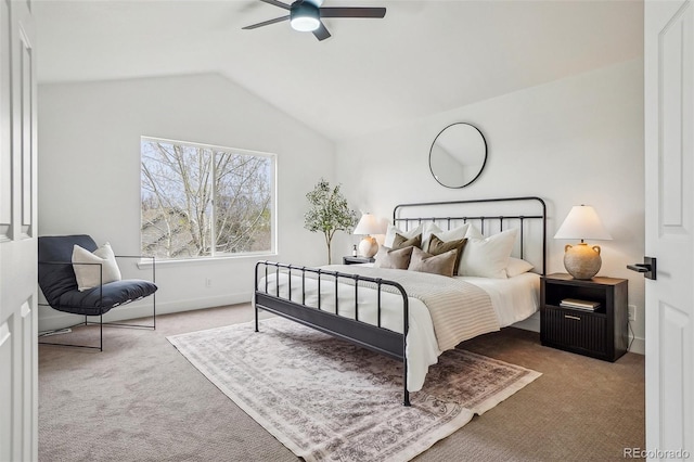 carpeted bedroom with baseboards, a ceiling fan, and lofted ceiling