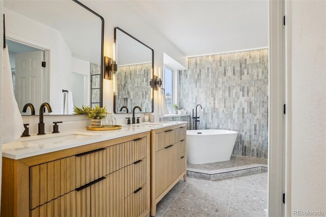 1057 English Sparrow Trl, Highlands Ranch, CO 80129 - bathroom with double vanity, a sink, and a soaking tub