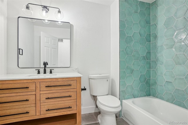 full bath with vanity, toilet, tile patterned floors, baseboards, and shower / washtub combination