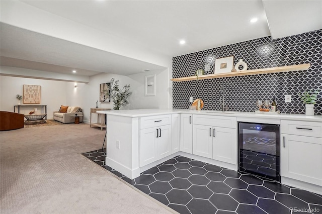 bar featuring dark carpet, indoor wet bar, recessed lighting, wine cooler, and backsplash