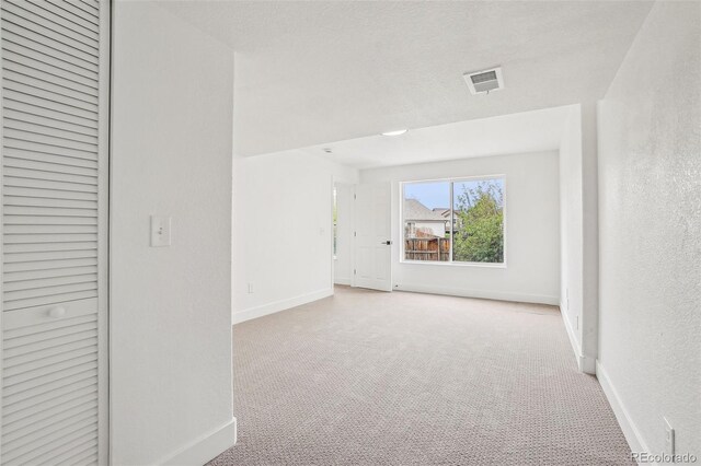 1057 English Sparrow Trl, Highlands Ranch, CO 80129 - unfurnished room featuring visible vents, baseboards, and carpet floors