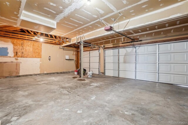 1057 English Sparrow Trl, Highlands Ranch, CO 80129 - garage featuring a garage door opener
