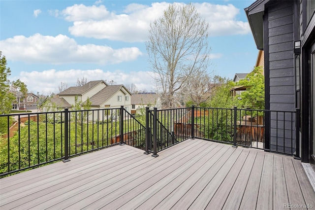 wooden deck featuring a residential view