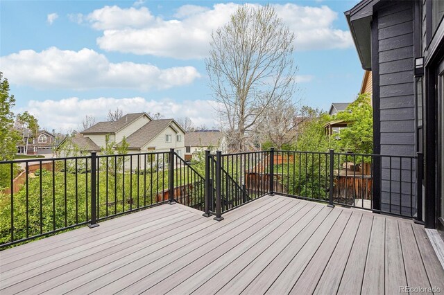 1057 English Sparrow Trl, Highlands Ranch, CO 80129 - wooden deck featuring a residential view