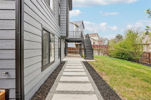 1057 English Sparrow Trl, Highlands Ranch, CO 80129 - view of yard featuring stairway, a residential view, and a fenced backyard
