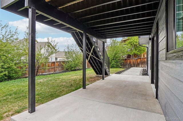 1057 English Sparrow Trl, Highlands Ranch, CO 80129 - view of patio with stairway and a fenced backyard
