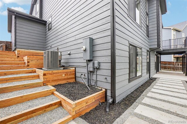 1057 English Sparrow Trl, Highlands Ranch, CO 80129 - view of home's exterior with central air condition unit and fence