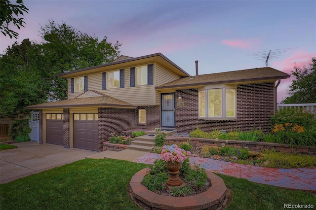 1729 S Ouray Ct, Aurora, CO 80017 - split level home with brick siding, driveway, a yard, and a shingled roof