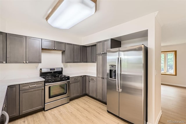1729 S Ouray Ct, Aurora, CO 80017 - kitchen featuring appliances with stainless steel finishes, light wood-style floors, and light countertops