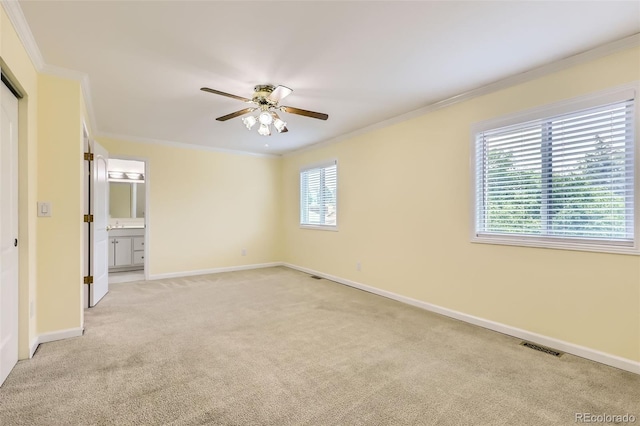 1729 S Ouray Ct, Aurora, CO 80017 - unfurnished bedroom featuring light carpet, ornamental molding, ceiling fan, and ensuite bathroom