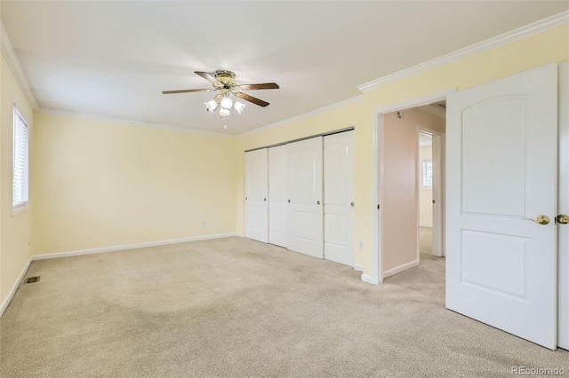 1729 S Ouray Ct, Aurora, CO 80017 - unfurnished bedroom with light colored carpet, ornamental molding, a closet, and ceiling fan
