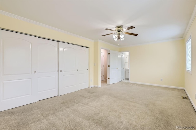 1729 S Ouray Ct, Aurora, CO 80017 - unfurnished bedroom with light carpet, a closet, ornamental molding, a ceiling fan, and ensuite bath