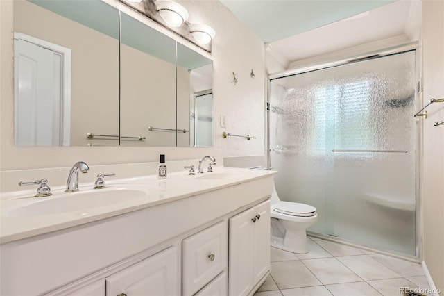1729 S Ouray Ct, Aurora, CO 80017 - full bathroom featuring tile patterned floors, double vanity, and a shower stall