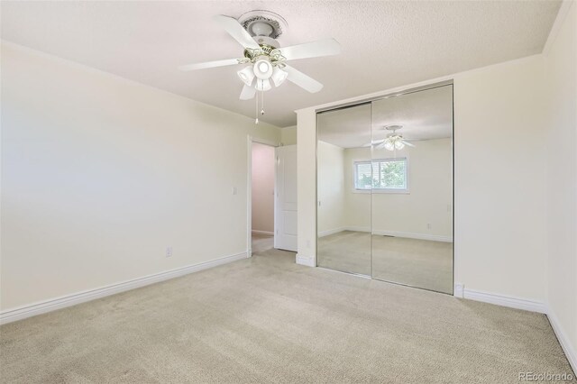 1729 S Ouray Ct, Aurora, CO 80017 - unfurnished bedroom featuring carpet flooring, a closet, ceiling fan, and a textured ceiling