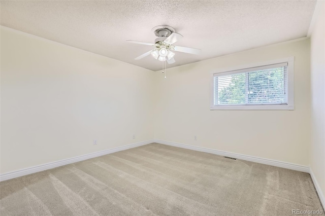1729 S Ouray Ct, Aurora, CO 80017 - unfurnished room with light carpet, a textured ceiling, and ceiling fan