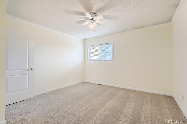 1729 S Ouray Ct, Aurora, CO 80017 - empty room featuring light colored carpet, ceiling fan, a textured ceiling, and crown molding