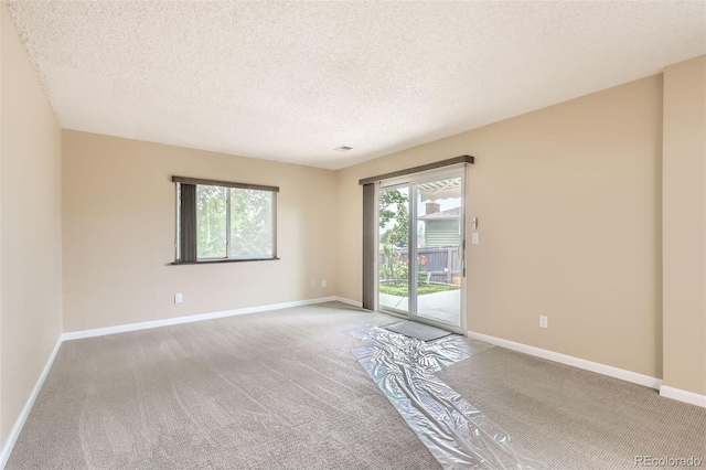 1729 S Ouray Ct, Aurora, CO 80017 - empty room with carpet and a textured ceiling