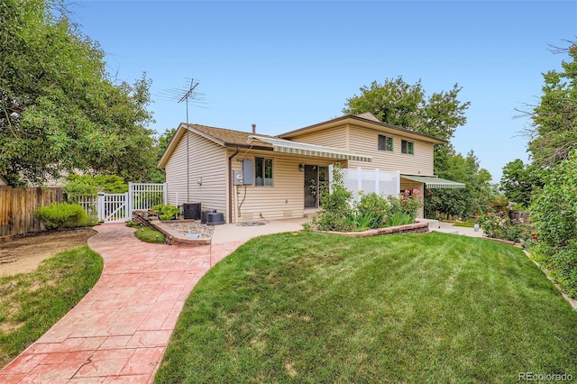 1729 S Ouray Ct, Aurora, CO 80017 - view of front facade featuring a patio and a gate