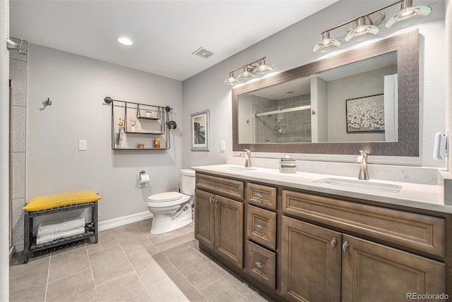 10994 Shadowbrook Cir, Highlands Ranch, CO 80130 - bathroom featuring a shower stall, double vanity, tile patterned flooring, and recessed lighting