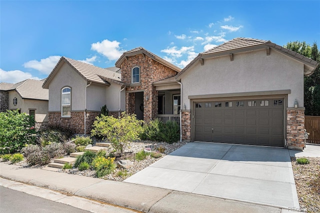 10994 Shadowbrook Cir, Highlands Ranch, CO 80130 - view of front of house featuring stone siding, stucco siding, concrete driveway, and a garage