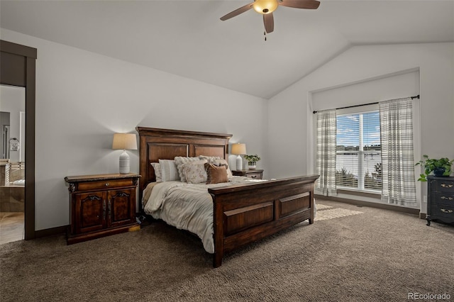 bedroom featuring connected bathroom, ceiling fan, dark carpet, and vaulted ceiling