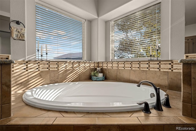 bathroom with tiled tub