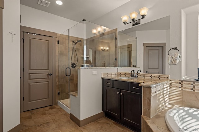 bathroom featuring vanity and separate shower and tub