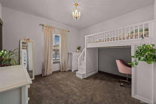 carpeted bedroom with a chandelier