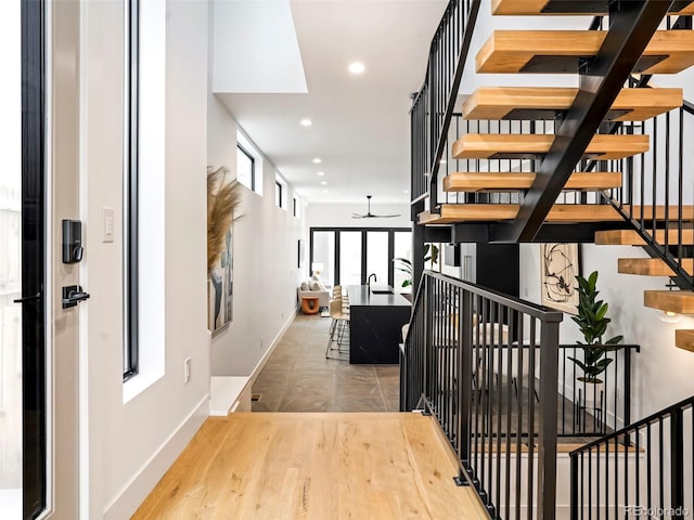 interior space featuring hardwood / wood-style flooring and ceiling fan