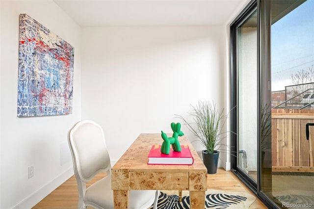 office space with light wood-type flooring