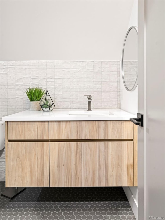 bathroom with vanity and toilet