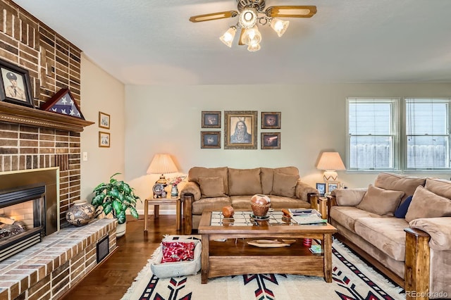 6376 S Pierson St, Littleton, CO 80127 - living area with ceiling fan, wood finished floors, and a fireplace