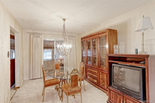 carpeted dining space with a notable chandelier