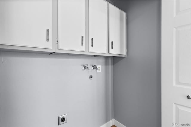 laundry room with cabinets, hookup for an electric dryer, and hookup for a washing machine