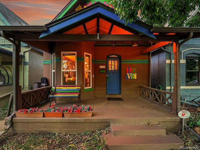 doorway to property with covered porch