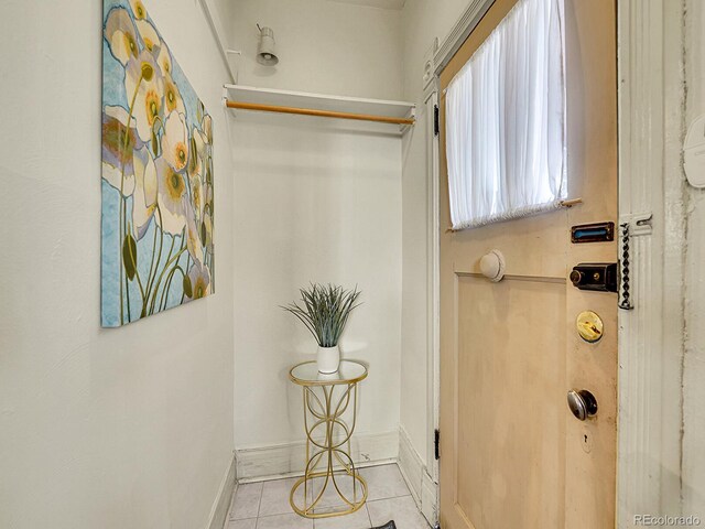 bathroom with tile patterned flooring and baseboards