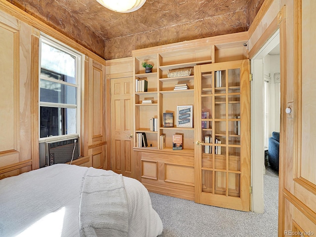 bedroom featuring cooling unit and carpet