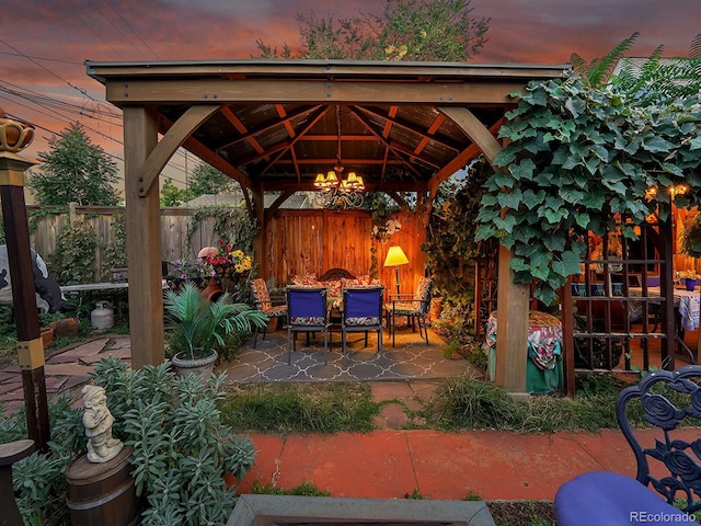 view of patio with a gazebo and fence