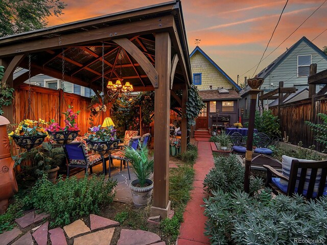 view of patio featuring a gazebo and fence