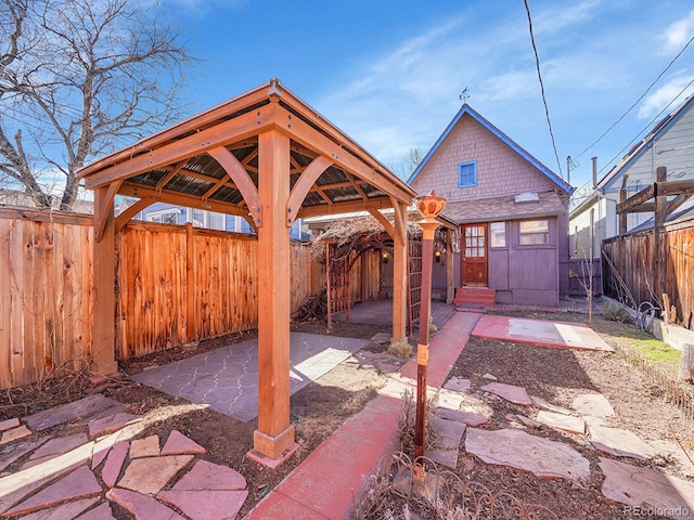 view of patio featuring entry steps and a fenced backyard