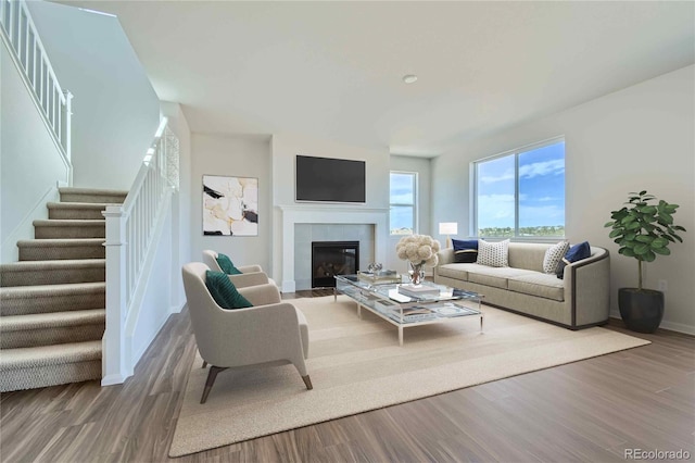 living room featuring a fireplace and hardwood / wood-style floors