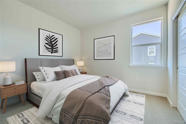 bedroom featuring light colored carpet