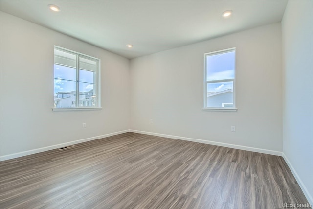 unfurnished room featuring wood-type flooring