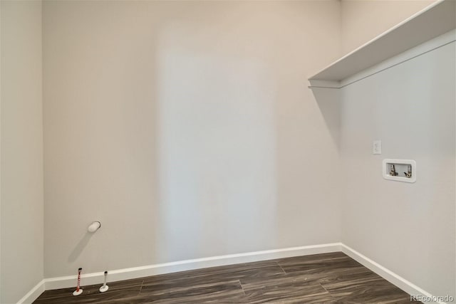 laundry room featuring hookup for a washing machine, dark hardwood / wood-style flooring, and gas dryer hookup