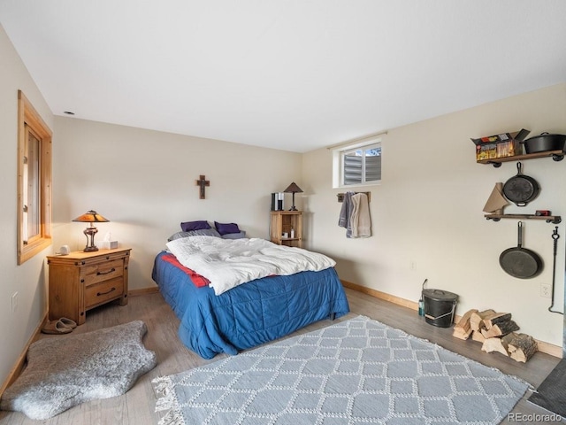 bedroom with hardwood / wood-style flooring