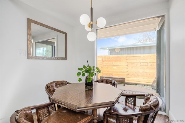 1380 S Dahlia St, Denver, CO 80222 - dining room featuring wood finished floors and a notable chandelier