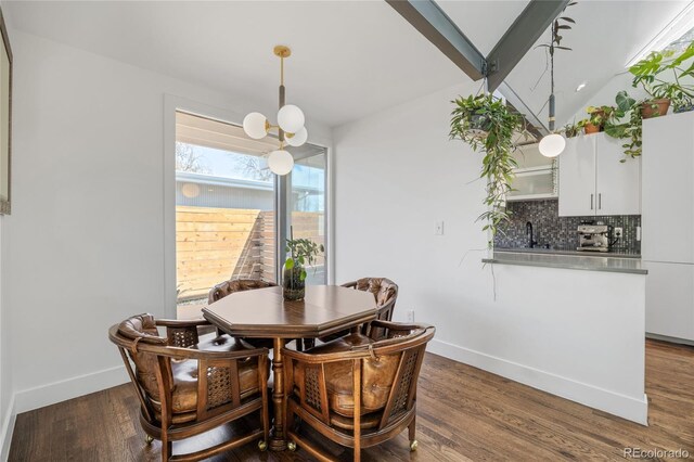 1380 S Dahlia St, Denver, CO 80222 - dining space featuring a chandelier, lofted ceiling, baseboards, and dark wood-style flooring